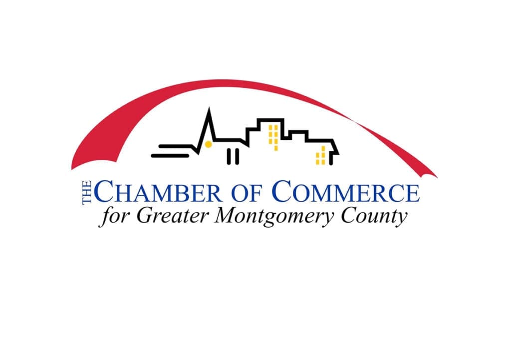 Logo of the Chamber of Commerce for Greater Montgomery County featuring a city skyline outline, a red swoosh above, and the organization’s name in blue and black text beneath the graphic.
