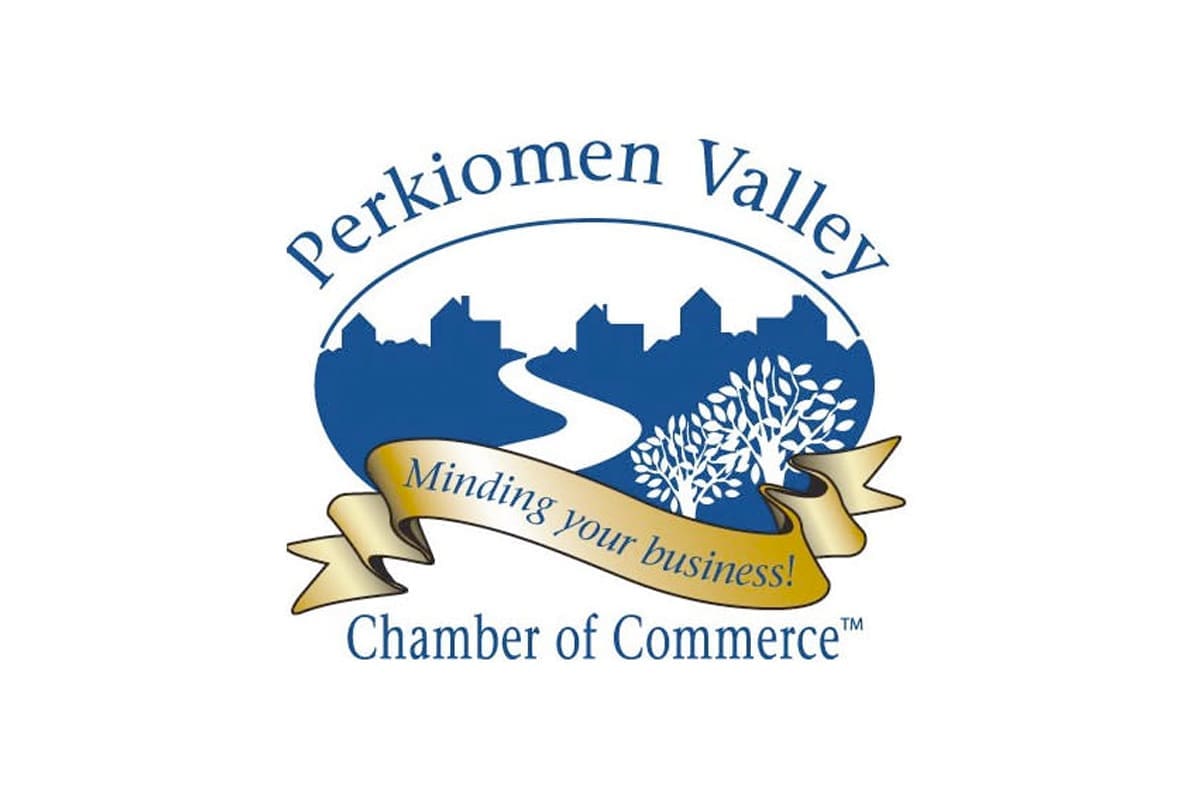 Logo of Perkiomen Valley Chamber of Commerce with a blue river, white tree, and house silhouettes. A gold ribbon reads "Minding your business!" in front of the scene.