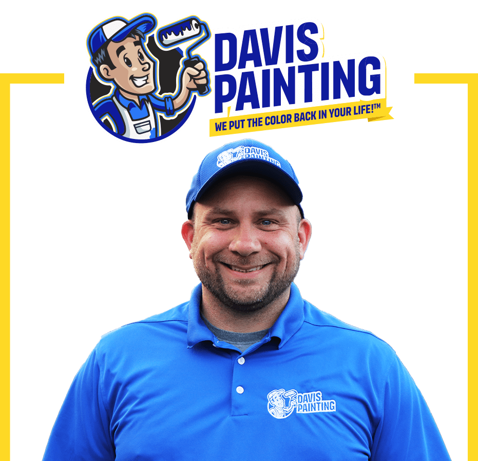 A smiling man in a blue Davis Painting shirt and cap stands below the Davis Painting logo, featuring a cartoon painter and their slogan, "We put the color back in your lifeâ„¢." Yellow lines frame this vibrant Davis Painting image.
